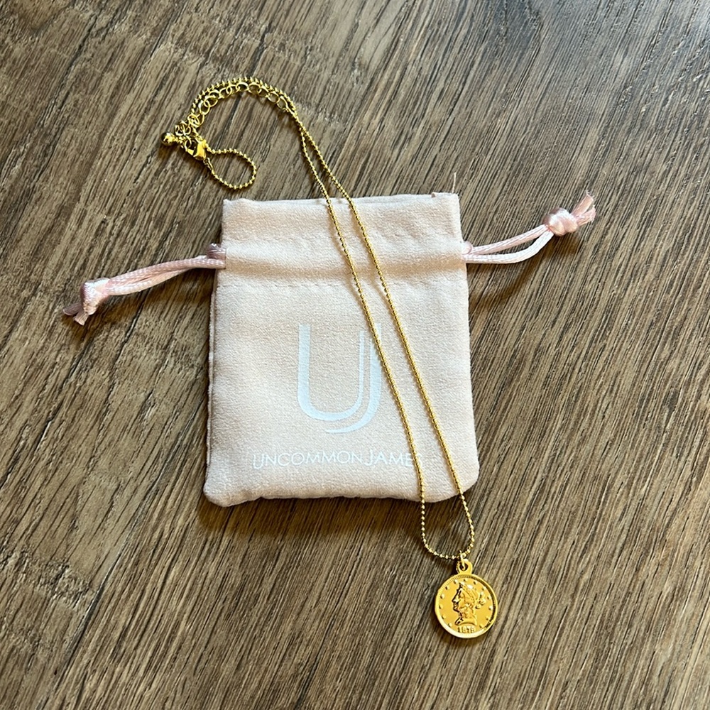 Uncommon James coin necklace